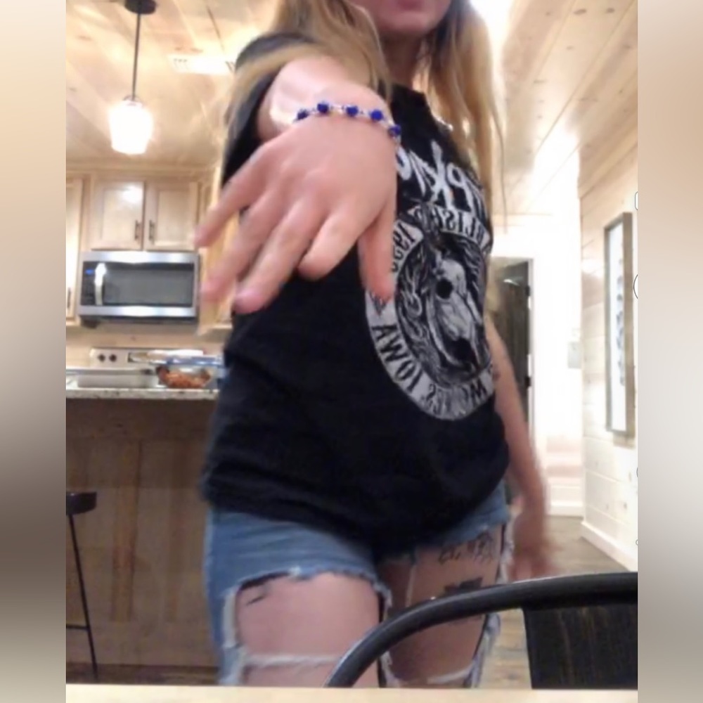 Very distressed denim jeans, light and airy lol. They’re very cute w fishnets!!